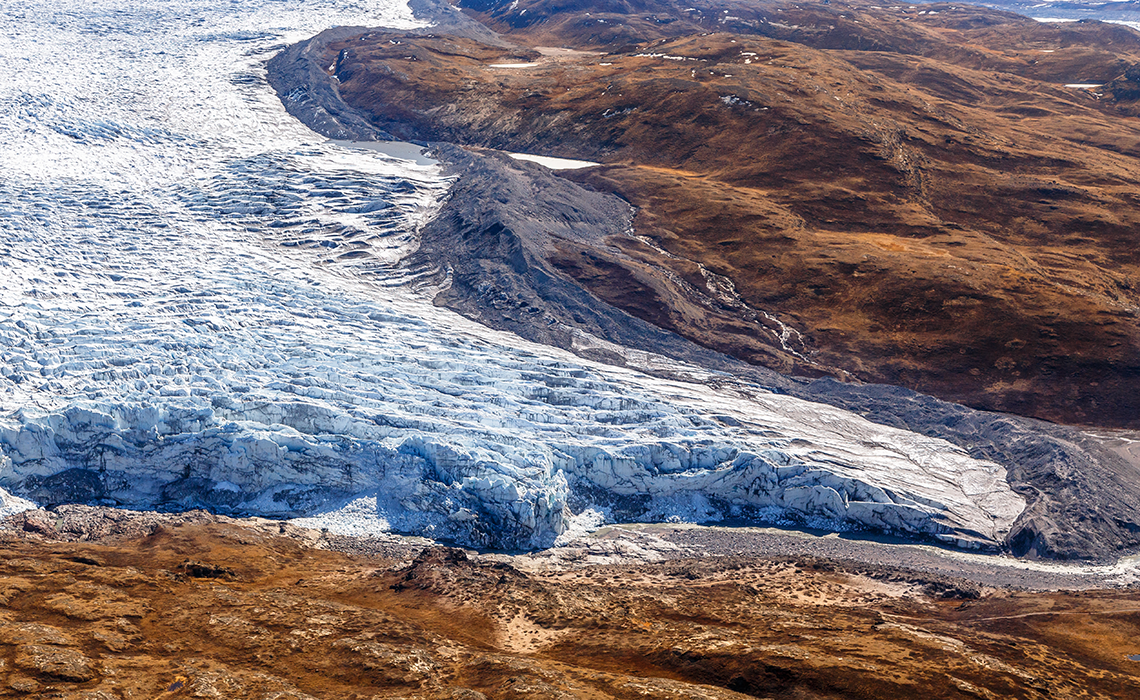 Greenlandic ice cap melting glacier with tundra aerial view, near Kangerlussuaq, Greenland
